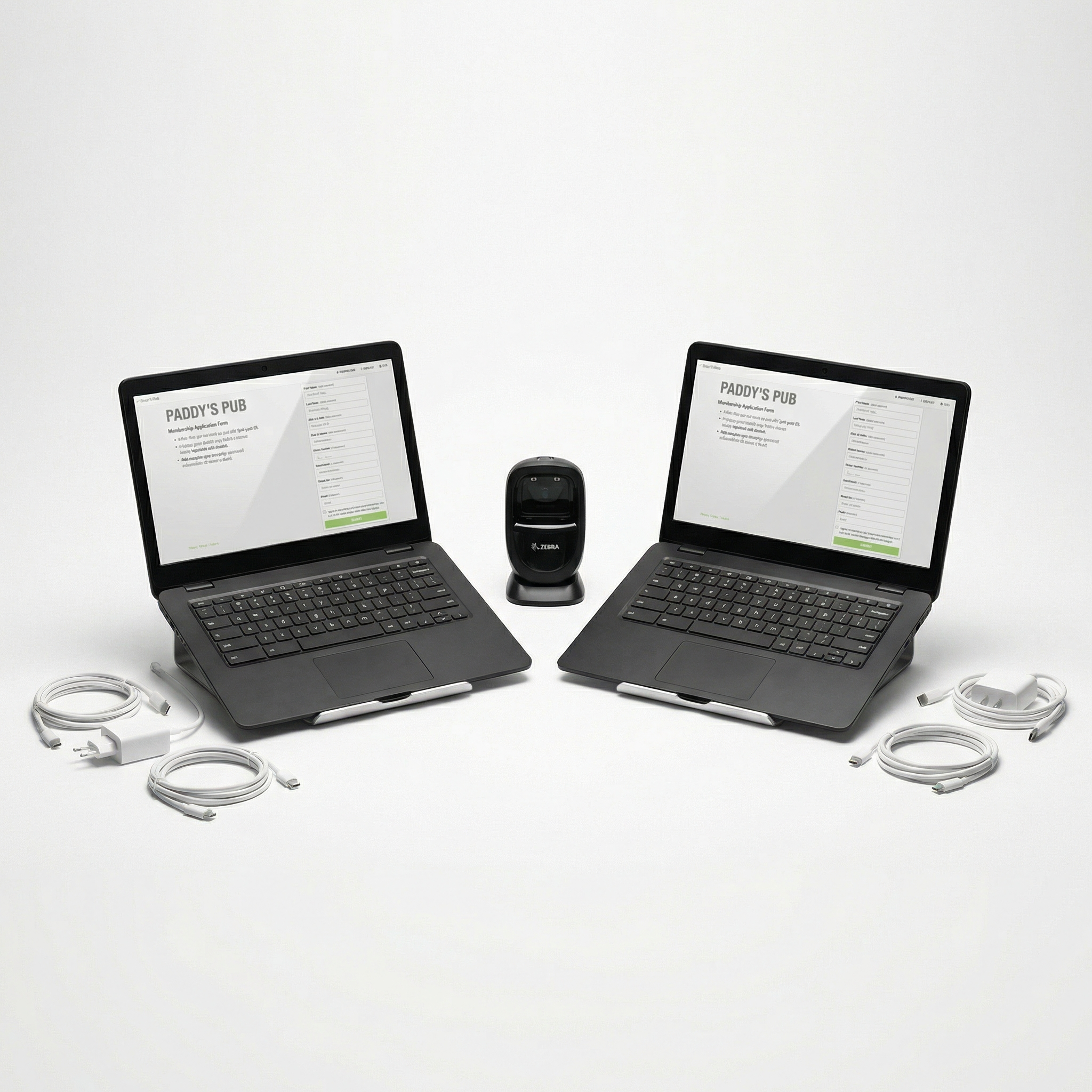 Two registration laptops with join screen and centered barcode scanner